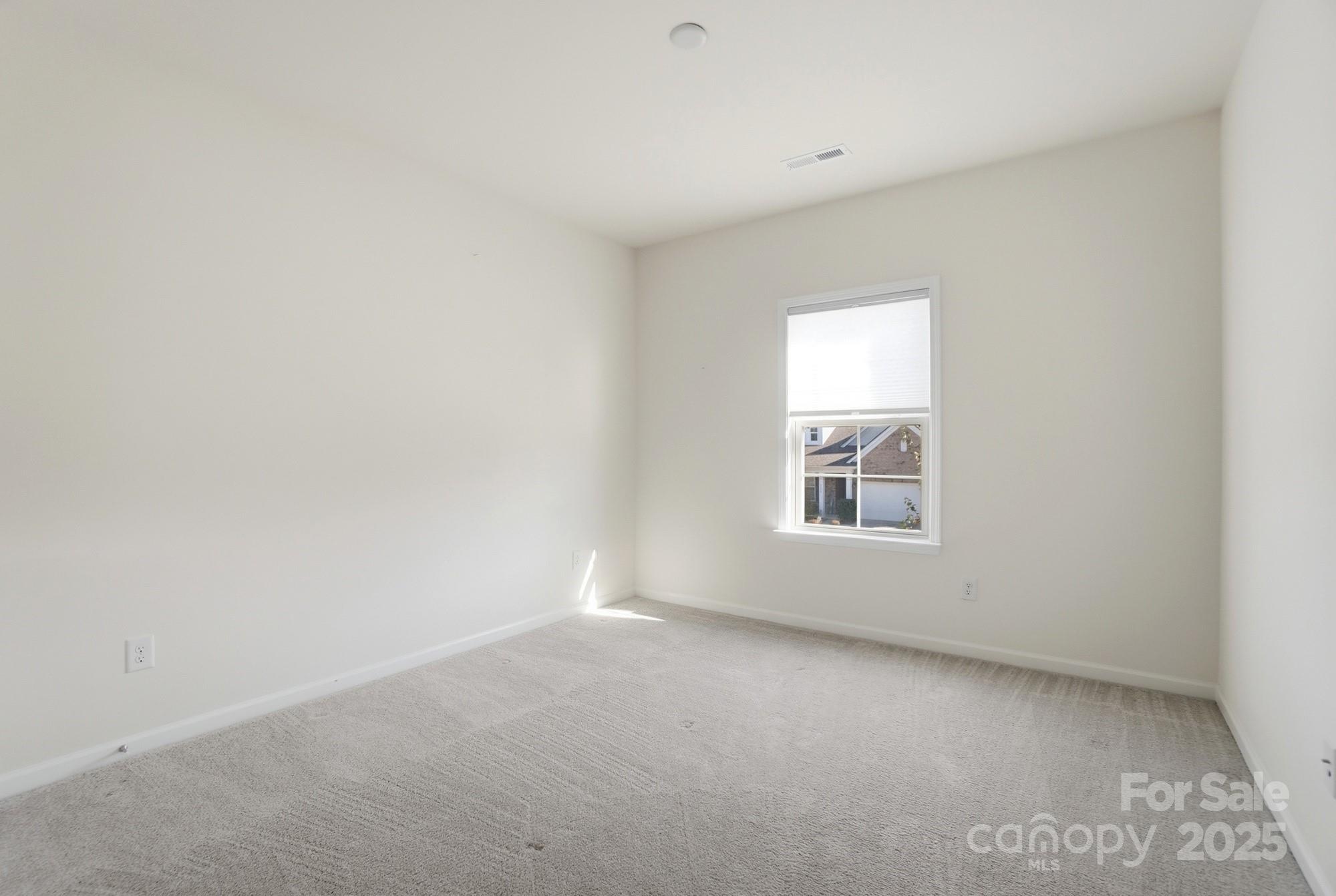 4325 Hunton Dale Road Northwest Concord, NC 28027 - Photo 31 of 42 an empty room with a window