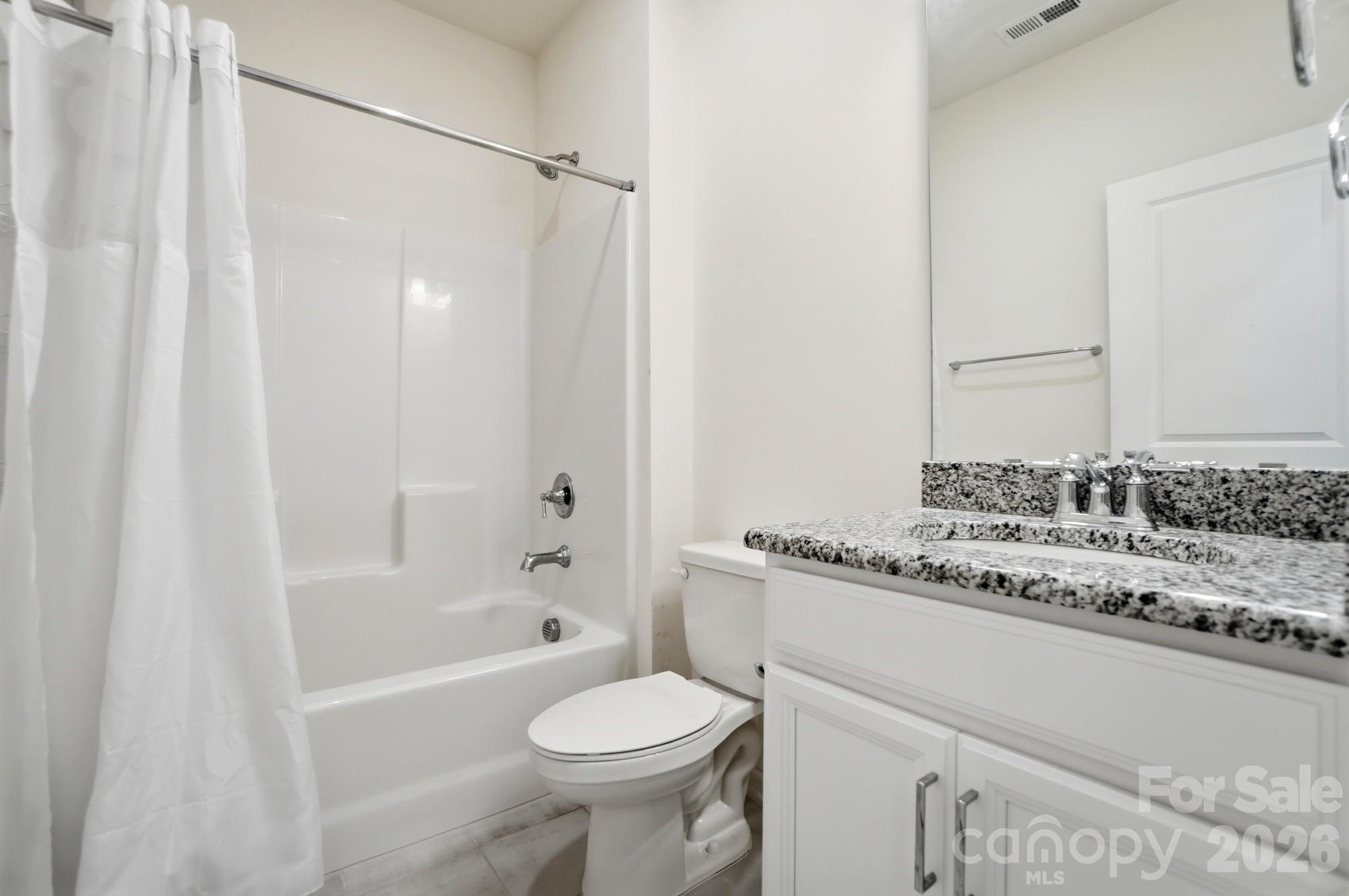 4325 Hunton Dale Road Northwest Concord, NC 28027 - Photo 32 of 42 a bathroom with a sink toilet and shower