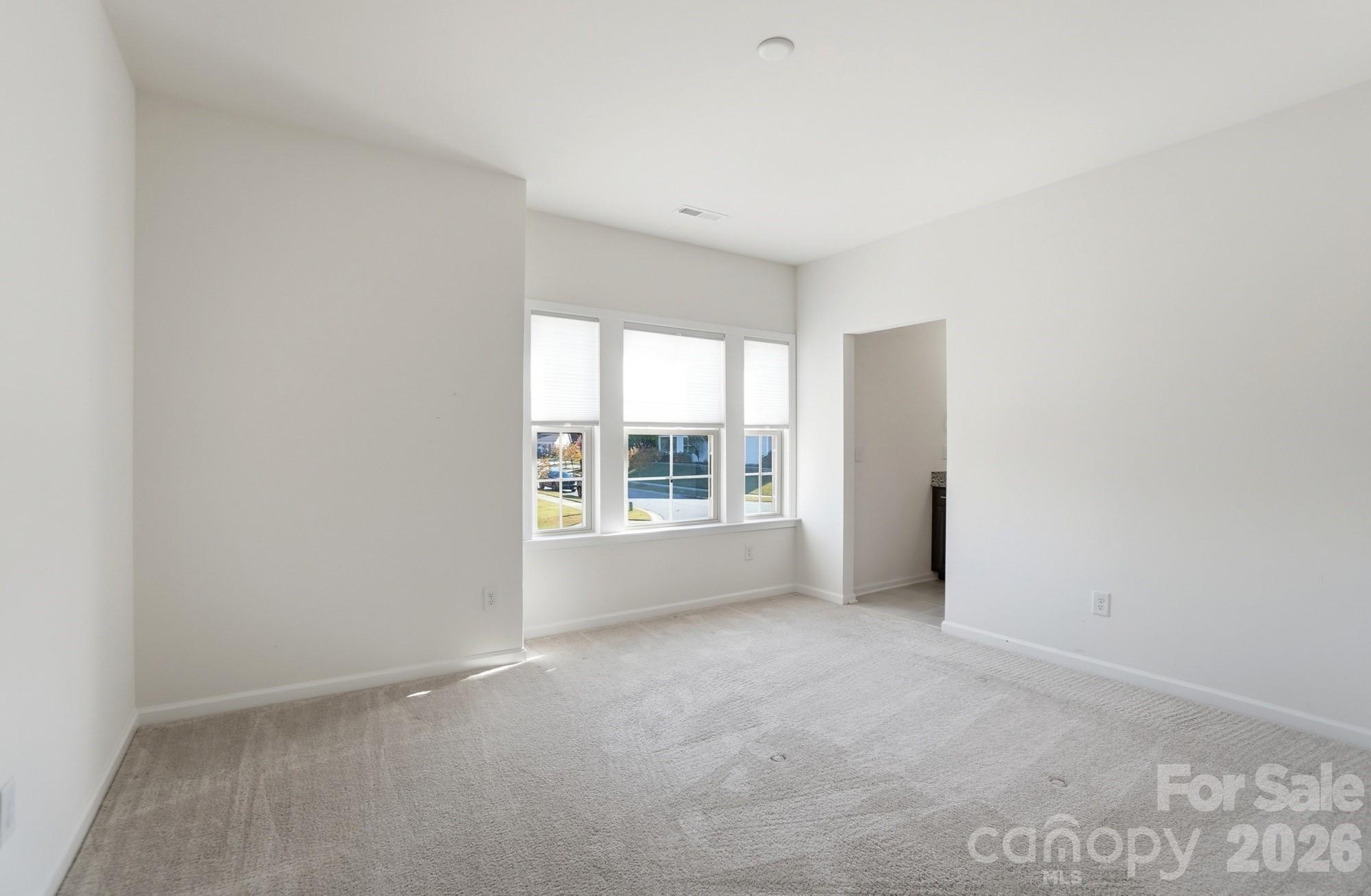 4325 Hunton Dale Road Northwest Concord, NC 28027 - Photo 33 of 42 a view of an empty room with a window