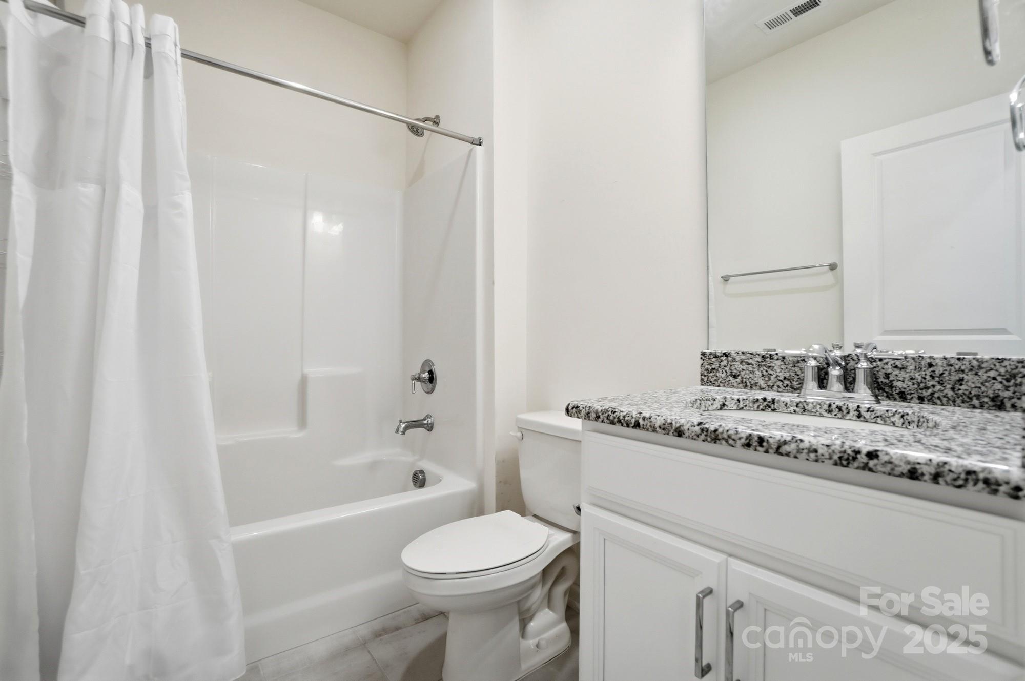 4325 Hunton Dale Road Northwest Concord, NC 28027 - Photo 33 of 42 a bathroom with a sink toilet and shower