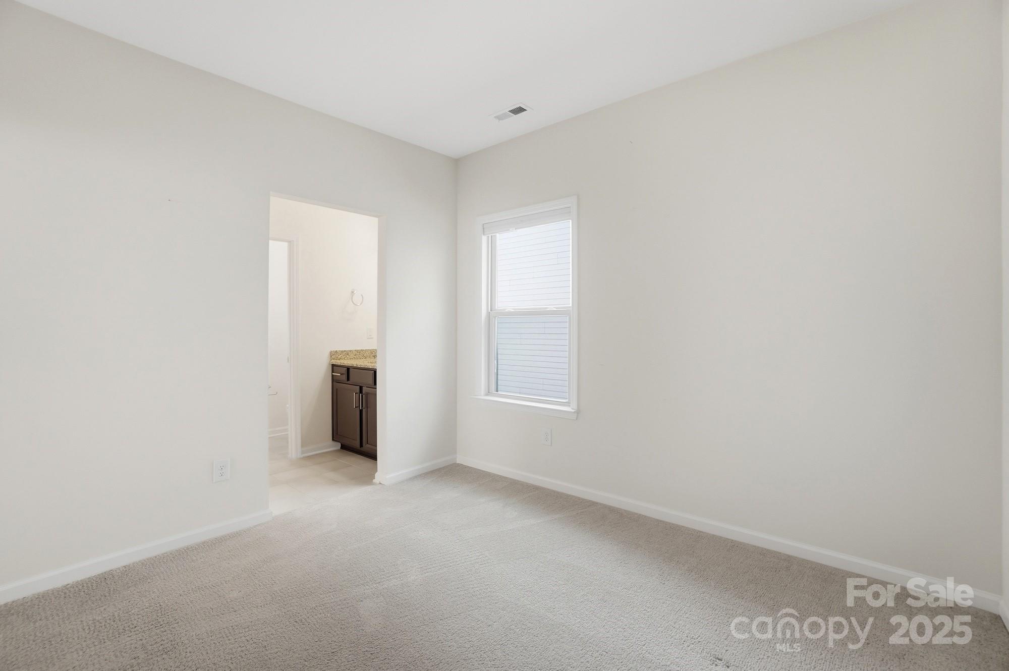 4325 Hunton Dale Road Northwest Concord, NC 28027 - Photo 38 of 42 a view of an empty room with a window