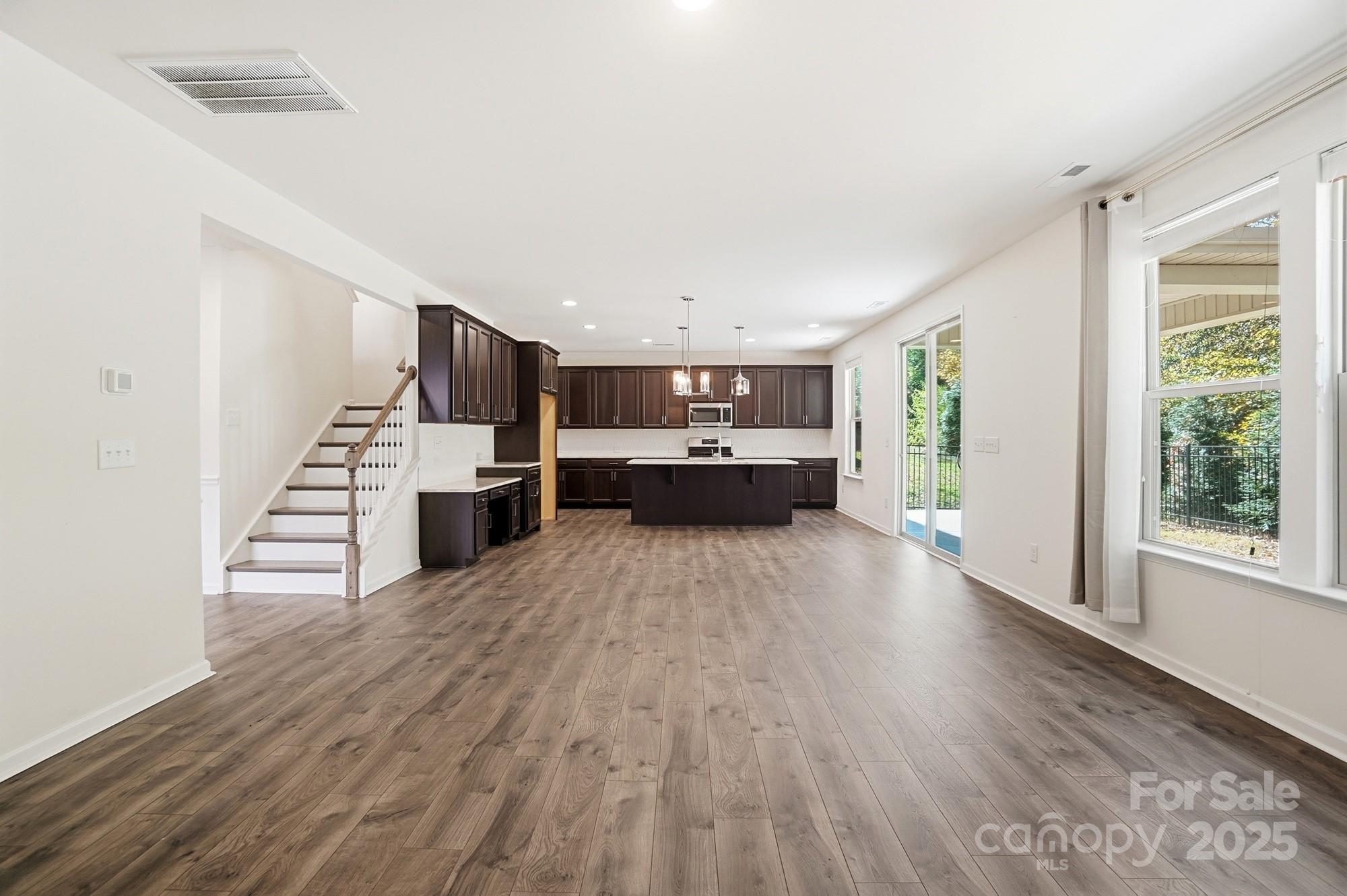 4325 Hunton Dale Road Northwest Concord, NC 28027 - Photo 7 of 42 a view of kitchen with furniture and wooden floor