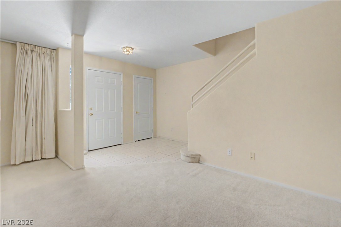 2243 Rugged Mesa Drive Laughlin, NV 89029 - Photo 28 of 32 A well-lit entry welcomes with a tiled floor and easy stair access.