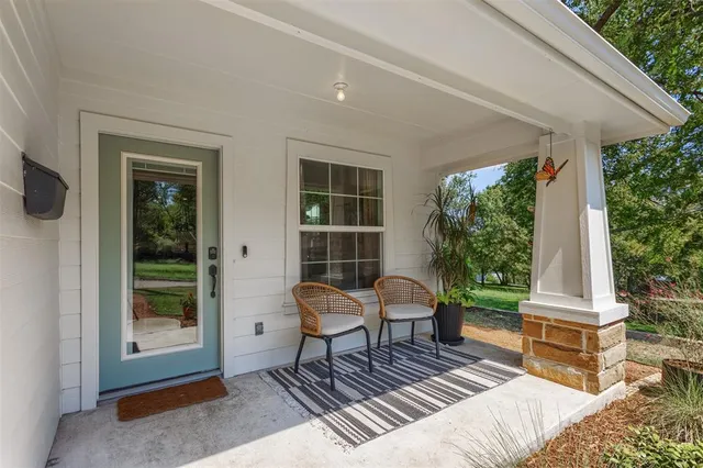 a outdoor space with a couch and chairs