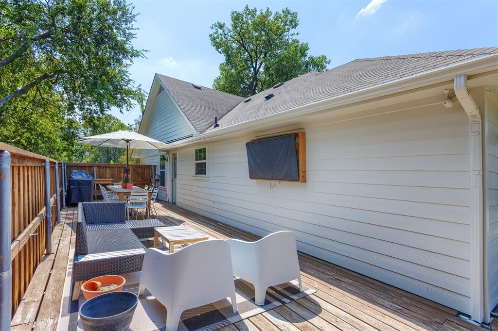 1211 Garcia Street McKinney, TX 75069 - Photo 22 of 27 a backyard of a house with table and chairs