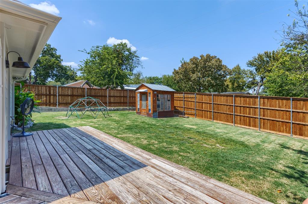 1211 Garcia Street McKinney, TX 75069 - Photo 23 of 27 a view of a backyard with a garden