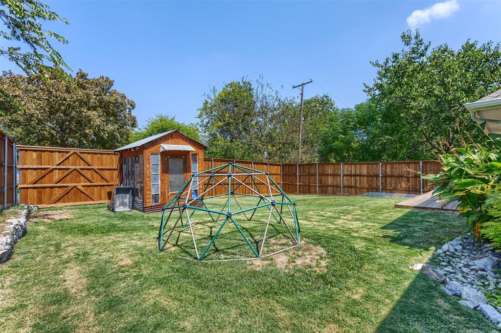 1211 Garcia Street McKinney, TX 75069 - Photo 24 of 27 a view of a backyard with table and chairs and potted plants
