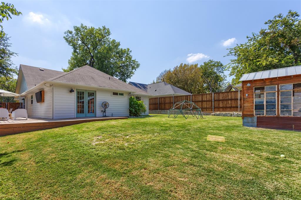 1211 Garcia Street McKinney, TX 75069 - Photo 26 of 27 a front view of a house with a garden