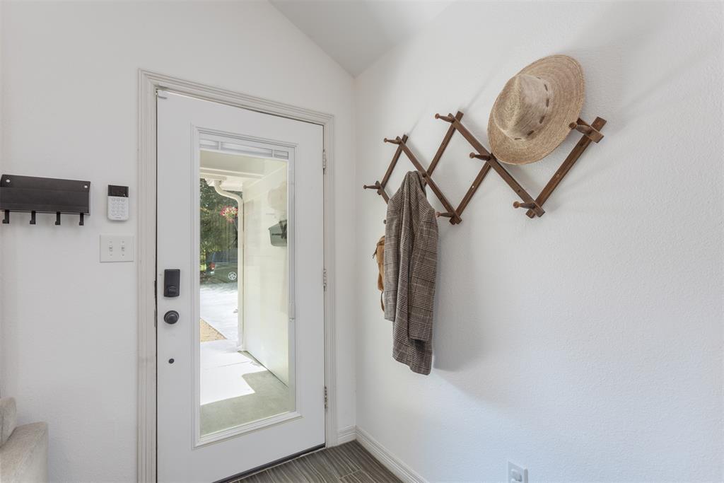 1211 Garcia Street McKinney, TX 75069 - Photo 3 of 27 a view of a hallway with a door and a glass door
