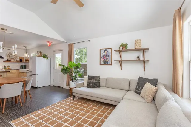 a living room with furniture and a rug
