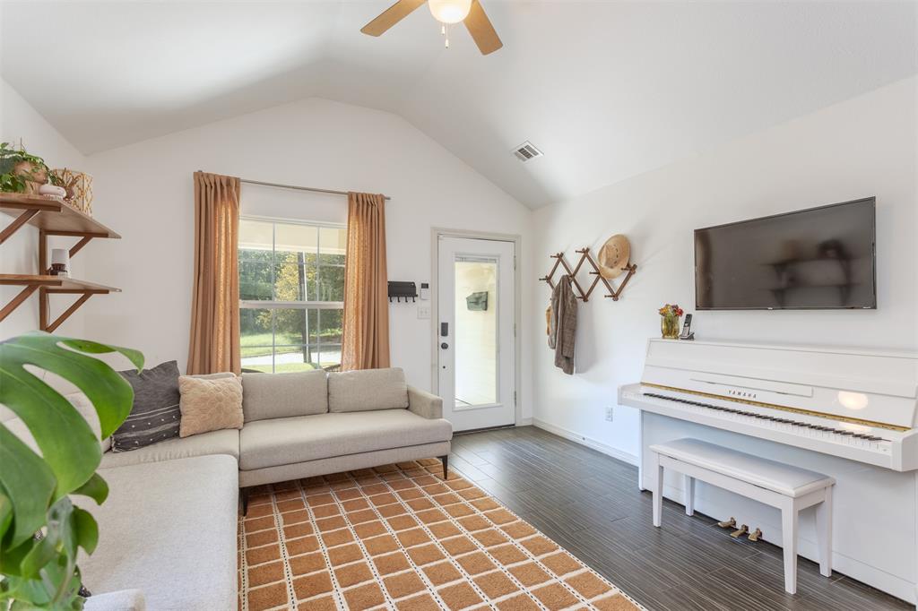 1211 Garcia Street McKinney, TX 75069 - Photo 6 of 27 a living room with furniture and a flat screen tv