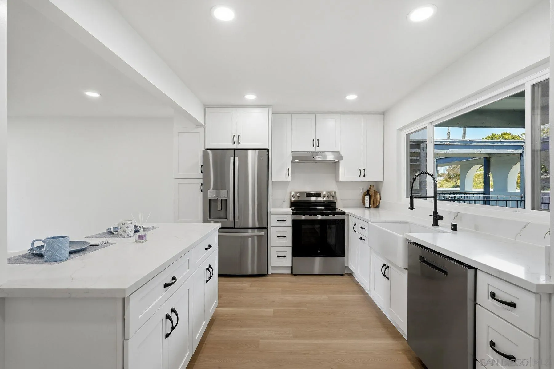 3606 Vista Rey, Unit 46 Oceanside, CA 92057 - Photo 6 of 36 a kitchen with refrigerator a sink and a refrigerator