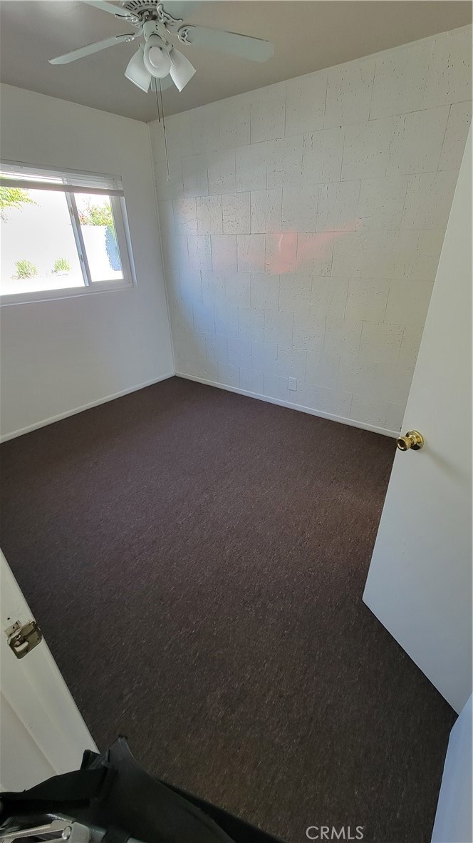 7004 Amethyst Avenue, Unit 2 Rancho Cucamonga, CA 91701 - Photo 4 of 6 en empty room with windows