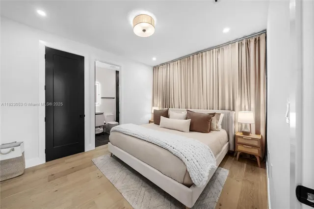 a bedroom with bed and window