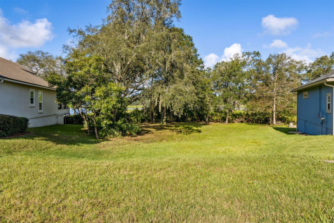 96282 Windsor Drive Yulee, FL 32097 - Photo 18 of 35 a view of a yard with a house
