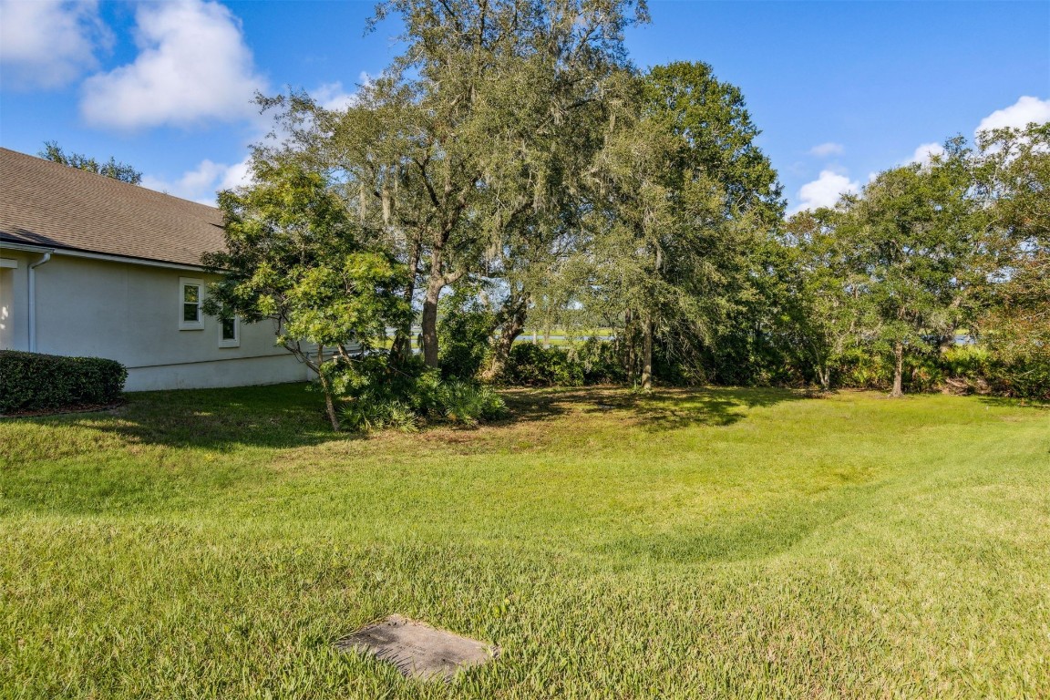 96282 Windsor Drive Yulee, FL 32097 - Photo 19 of 35 a view of a swimming pool with an outdoor space