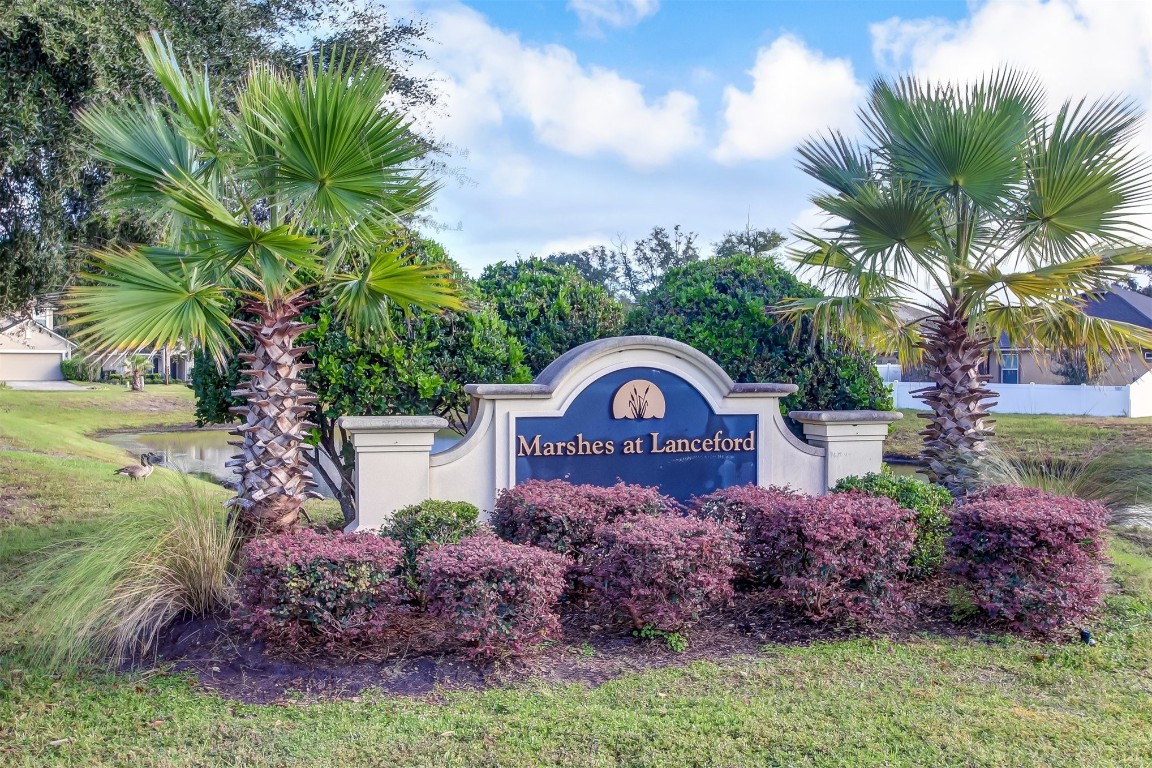 96282 Windsor Drive Yulee, FL 32097 - Photo 22 of 35 a view of a garden with a house