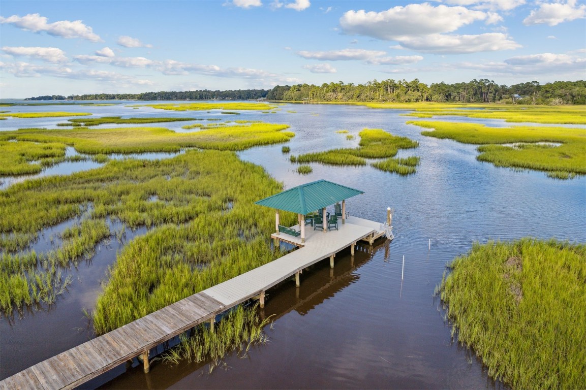 96282 Windsor Drive Yulee, FL 32097 - Photo 32 of 35 a view of an swimming pool and an outdoor seating