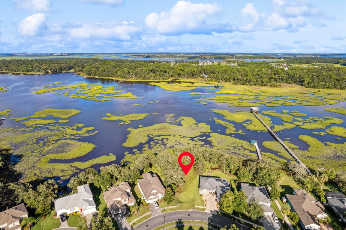 96282 Windsor Drive Yulee, FL 32097 - Photo 5 of 35 a view of an swimming pool and an outdoor seating