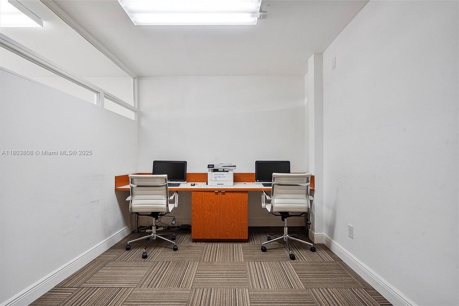 9511 Collins Avenue, Unit 1002 Surfside, FL 33154 - Photo 16 of 27 a view of a workspace with furniture and a window
