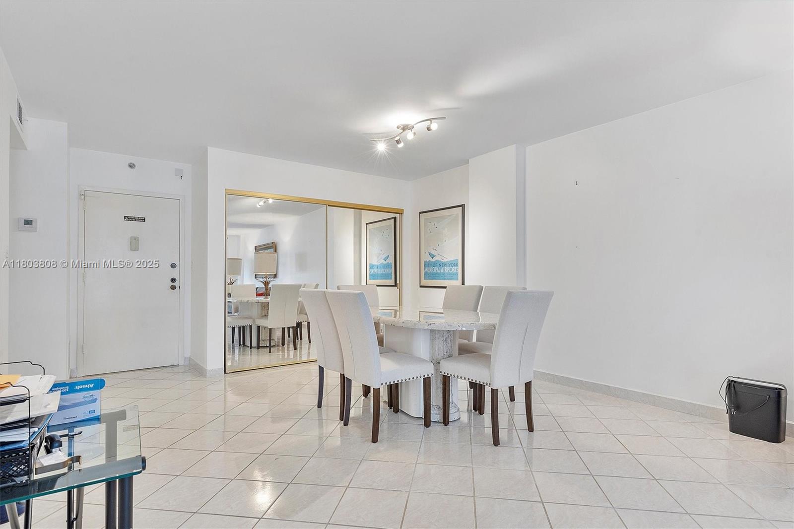 9511 Collins Avenue, Unit 1002 Surfside, FL 33154 - Photo 7 of 27 a view of a dining room with furniture