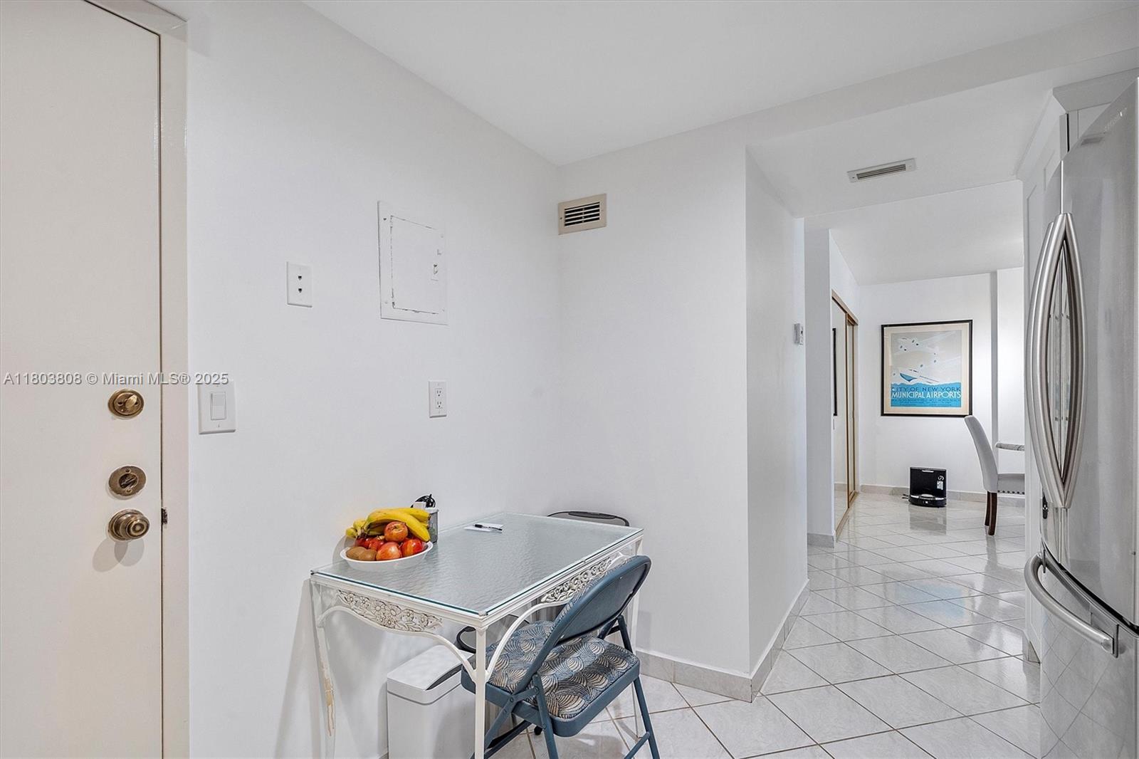 9511 Collins Avenue, Unit 1002 Surfside, FL 33154 - Photo 10 of 27 a room with a table and gym equipment