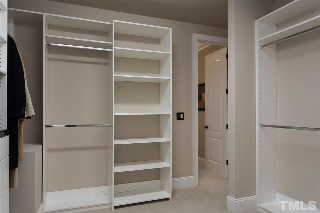 3929 Colinwood Lane Raleigh, NC 27606 - Photo 11 of 24 a view of walk in closet with empty racks