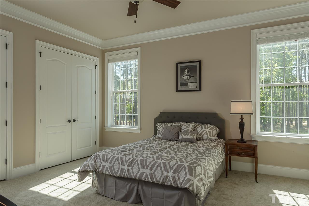 3929 Colinwood Lane Raleigh, NC 27606 - Photo 12 of 24 a bedroom with a bed and a window