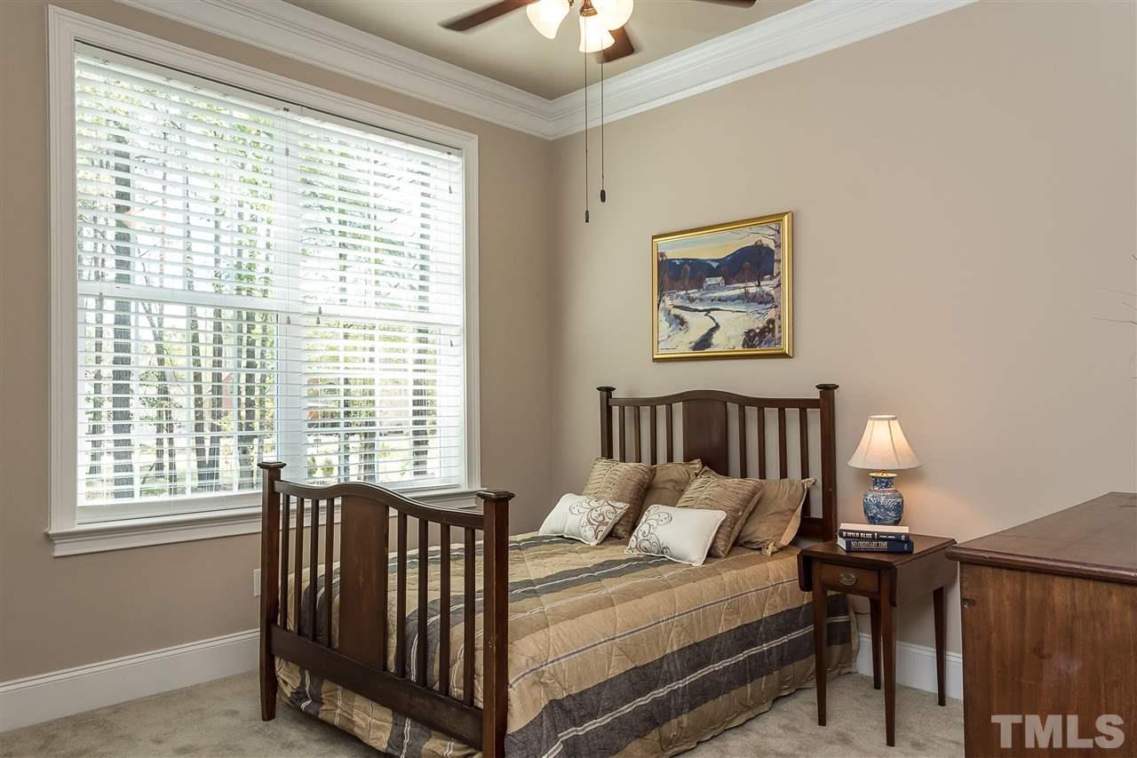 3929 Colinwood Lane Raleigh, NC 27606 - Photo 14 of 24 a bedroom with a bed and a window
