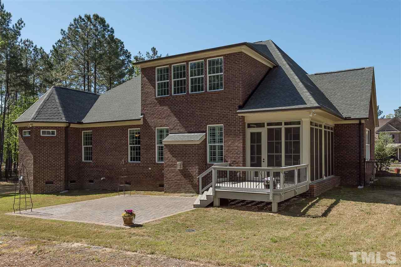 3929 Colinwood Lane Raleigh, NC 27606 - Photo 22 of 24 a front view of a house with a yard