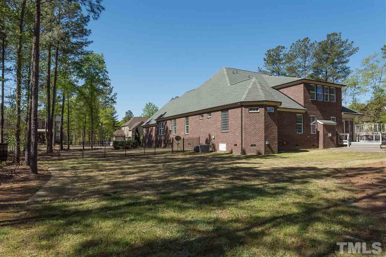 3929 Colinwood Lane Raleigh, NC 27606 - Photo 23 of 24 a front view of a house with a garden