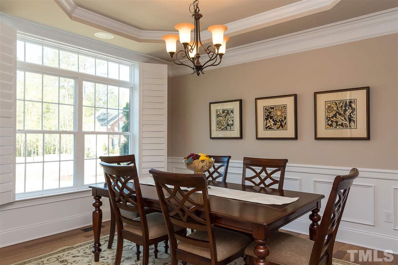 3929 Colinwood Lane Raleigh, NC 27606 - Photo 4 of 24 a view of a dining room with furniture window and wooden floor