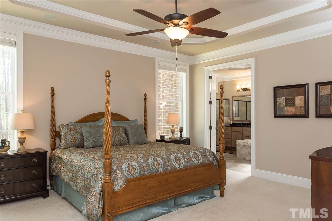 3929 Colinwood Lane Raleigh, NC 27606 - Photo 8 of 24 a bedroom with a bed and window