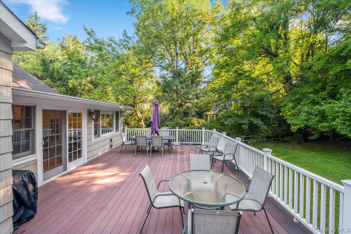 372 Fort Hill Road Scarsdale, NY 10583 - Photo 27 of 40 Enjoy hosting bbqs on the expansive deck overlooking the lushly landscaped private yard