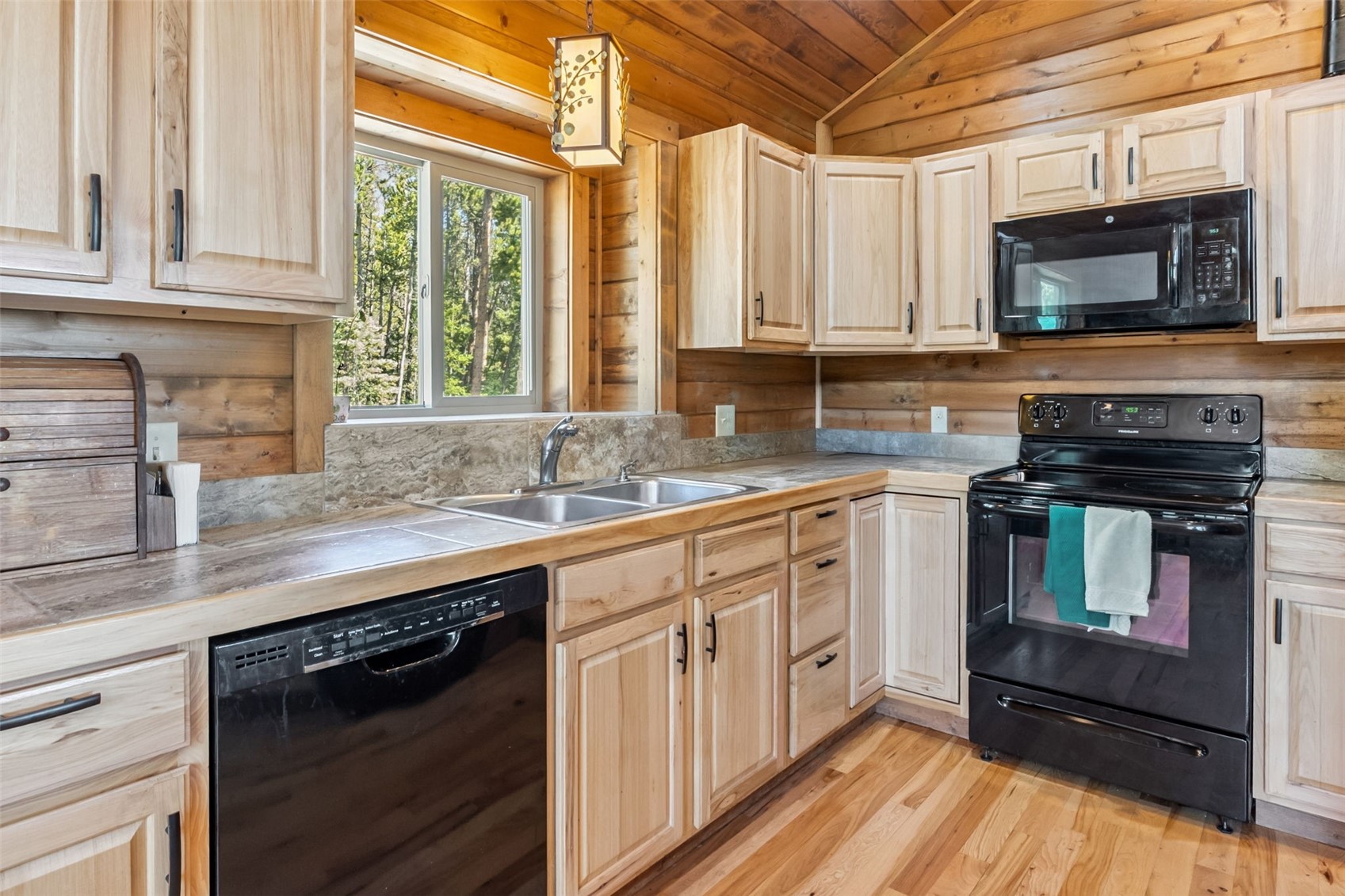 889 Venture Road Fairplay, CO 80440 - Photo 11 of 38 a kitchen with granite countertop a stove a sink and a microwave
