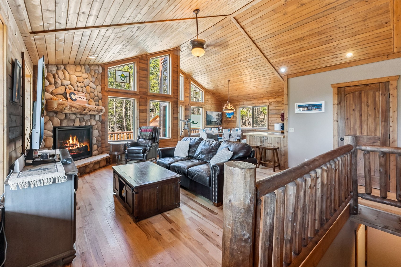 889 Venture Road Fairplay, CO 80440 - Photo 6 of 38 a living room with furniture fireplace and a large window