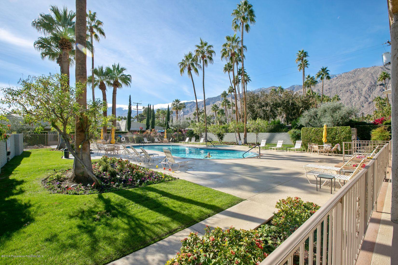1111 East Ramon Road, Unit 85 Palm Springs, CA 92264 - Photo 20 of 29 a view of a yard and palm trees