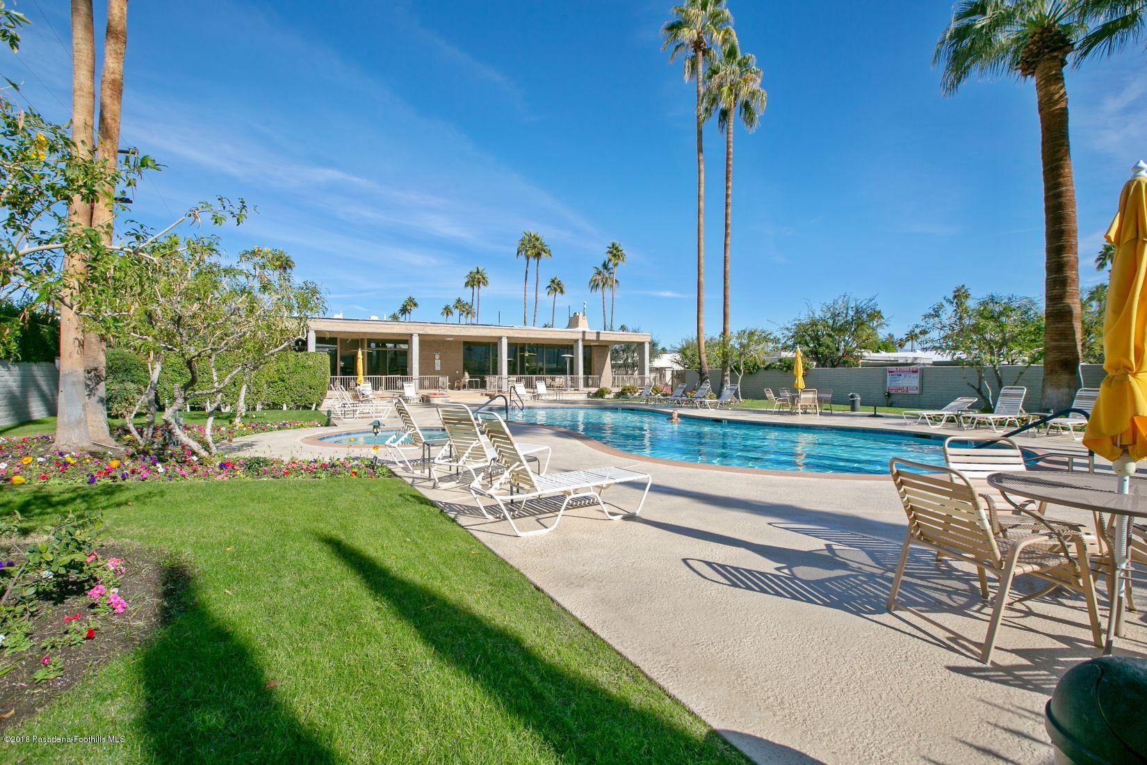 1111 East Ramon Road, Unit 85 Palm Springs, CA 92264 - Photo 21 of 29 a view of a swimming pool with a patio