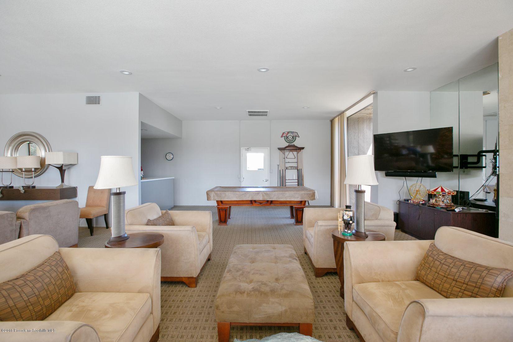 1111 East Ramon Road, Unit 85 Palm Springs, CA 92264 - Photo 23 of 29 a living room with furniture and a flat screen tv
