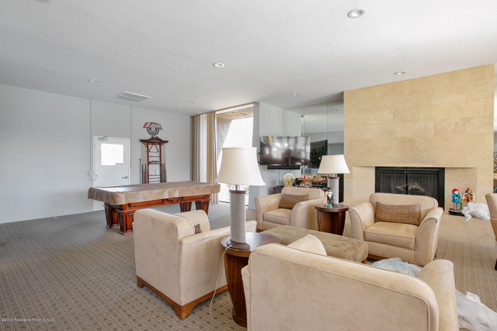 1111 East Ramon Road, Unit 85 Palm Springs, CA 92264 - Photo 25 of 29 a living room with furniture and a fireplace