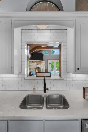 a kitchen with a sink and a stove