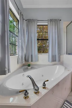 a bathroom with a tub and a sink
