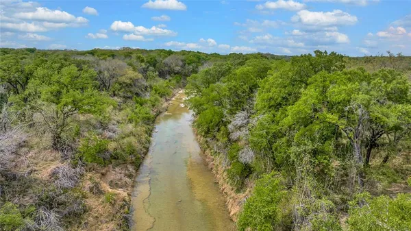 a view of swimming pool with a yard