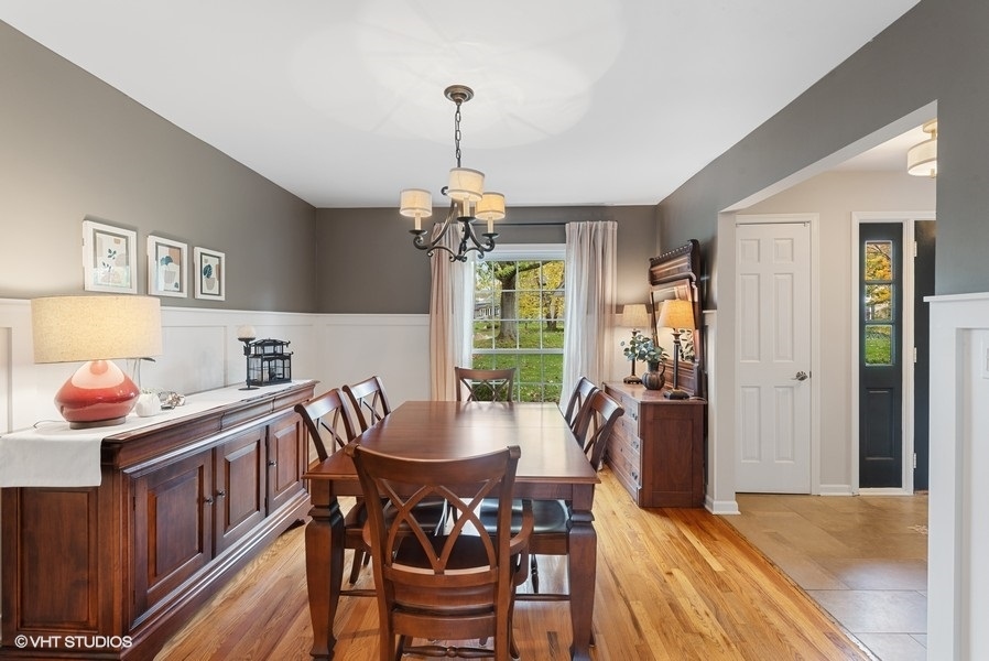 7 Knoll Ridge Road Rolling Meadows, IL 60008 - Photo 13 of 37 a dining room with furniture a chandelier and wooden floor