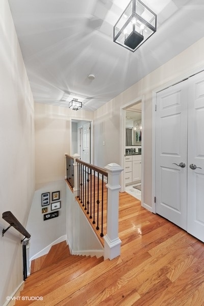 7 Knoll Ridge Road Rolling Meadows, IL 60008 - Photo 15 of 37 a view of a hallway with wooden floor and staircase