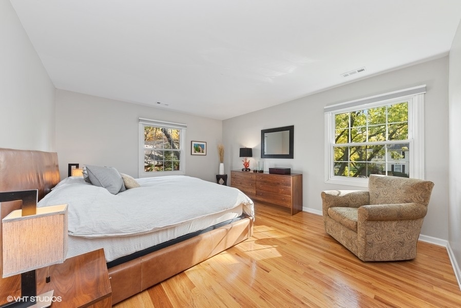 7 Knoll Ridge Road Rolling Meadows, IL 60008 - Photo 16 of 37 a bedroom with furniture and a large window