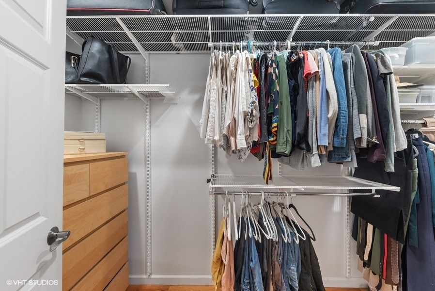 7 Knoll Ridge Road Rolling Meadows, IL 60008 - Photo 20 of 37 a view of walk in closet with clothes and shoes