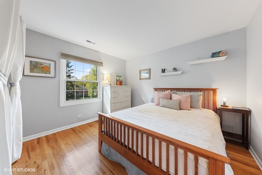 7 Knoll Ridge Road Rolling Meadows, IL 60008 - Photo 21 of 37 a bedroom with a bed and a window