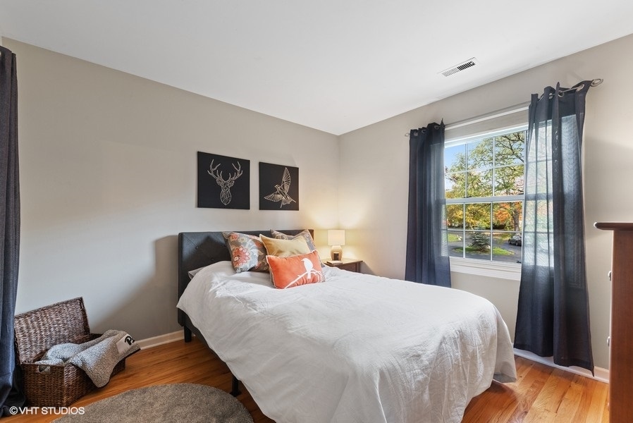 7 Knoll Ridge Road Rolling Meadows, IL 60008 - Photo 22 of 37 a bedroom with a bed and a window