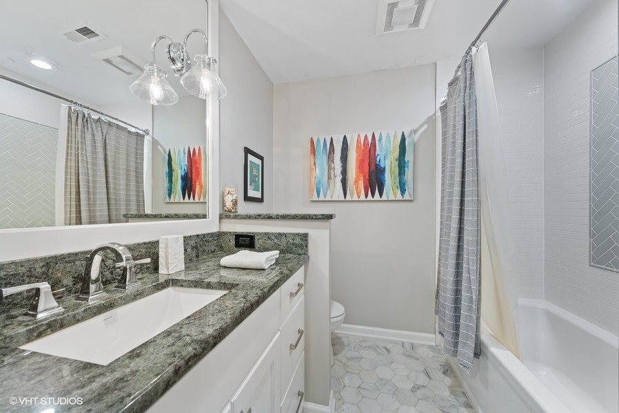 7 Knoll Ridge Road Rolling Meadows, IL 60008 - Photo 24 of 37 a bathroom with a granite countertop double vanity sink and a mirror